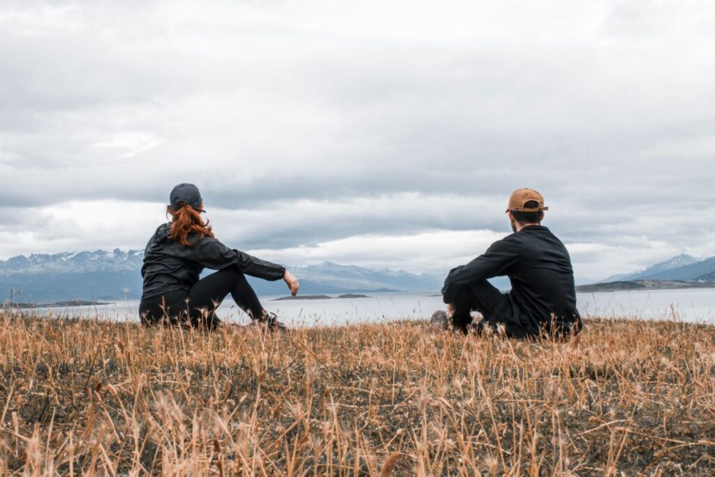 two people sitting together quietly settled showing the earned closeness that comes from learning how to fix a relationship